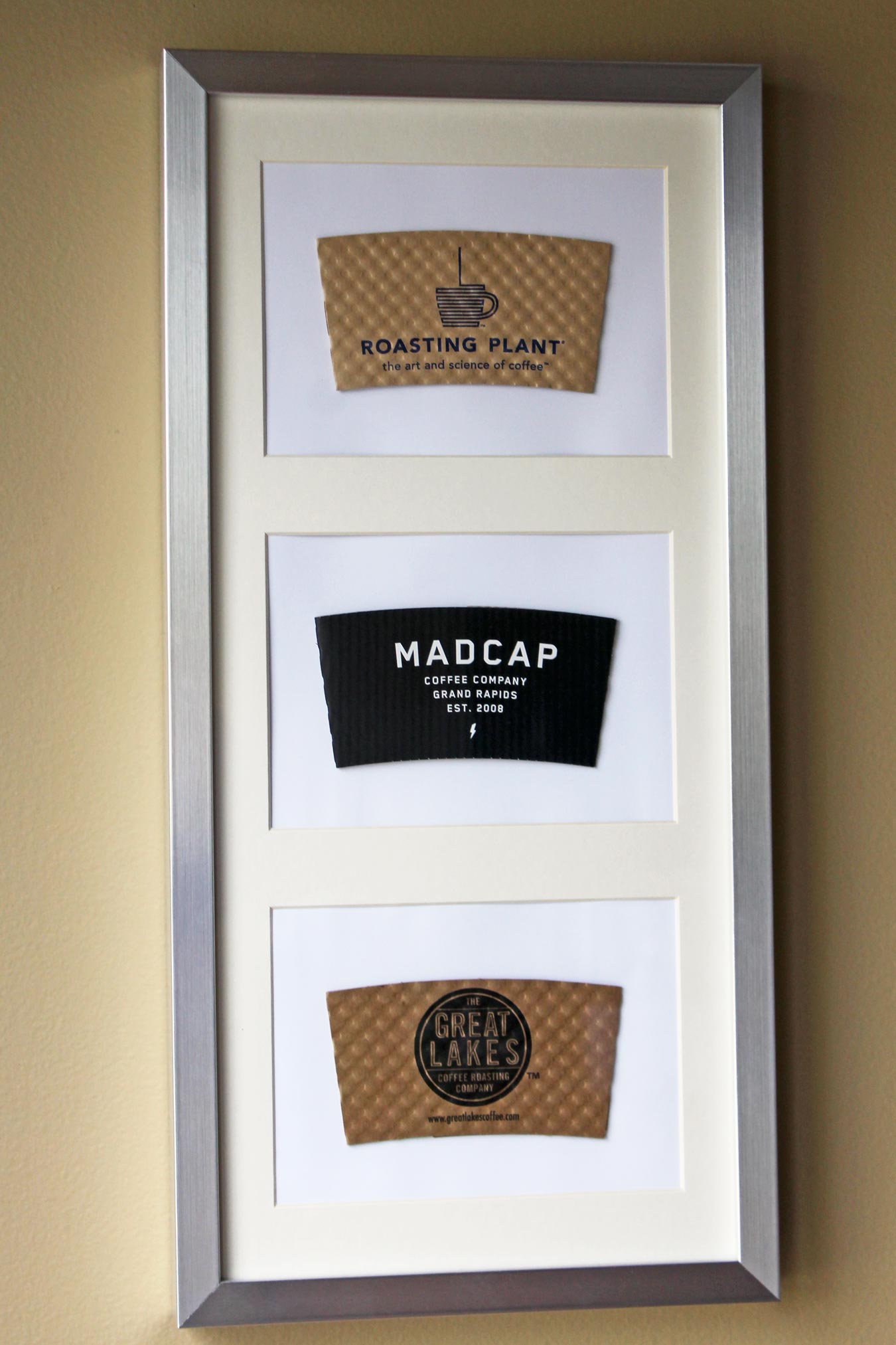 How To Repurpose Coffee Sleeves As Wall Art [via Wading in Big Shoes]