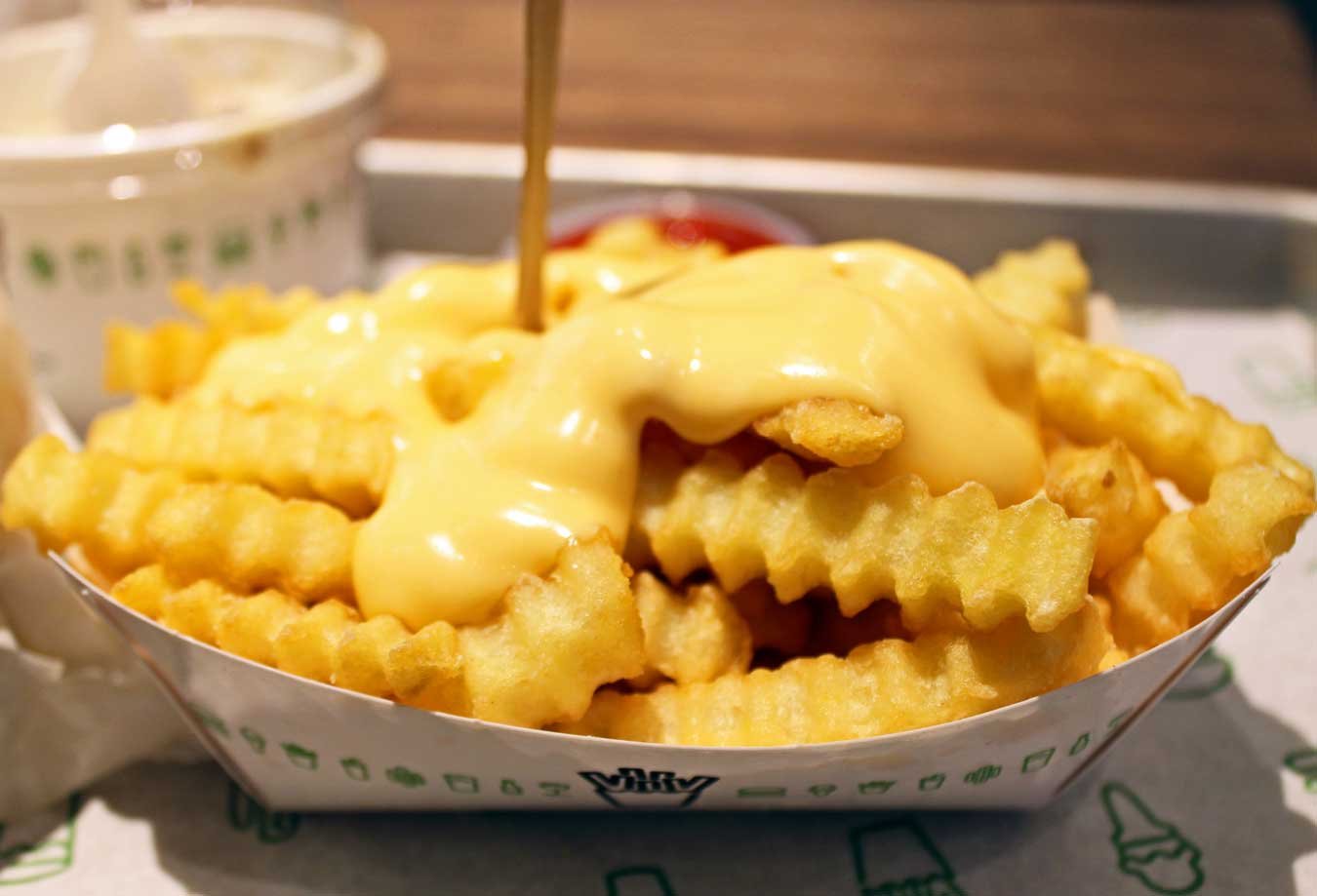 Cheese Fries at Shake Shack in Downtown Detroit /// Shake Shack Detroit Might Be Your New Favorite Burger Spot /// - From sandwiches, fries, and shakes to local flavors and an awesome location, learn why long-time fans and newbies alike are sure to love the new Shake Shack in Downtown Detroit, Michigan. /// via Wading in Big Shoes