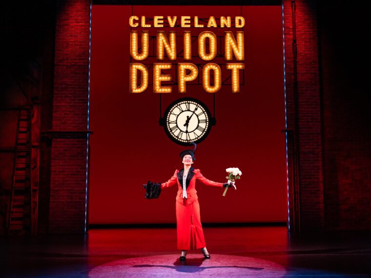 Fanny Brice sings "Don't Rain on my Parade" under a Cleveland Union Depot sign onstage in Funny Girl, the North American revival tour